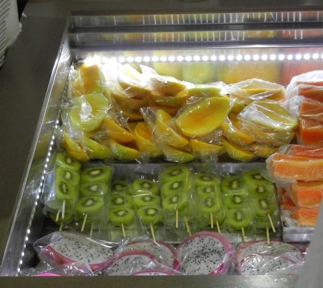 Fruit skewers from Lau Pa Sat. Caption: Fruits are plentiful in Singapore and cheap in Singapore. Get skewers of what many Westerners consider exotic fruits such as dragonfruit, wax apple, soursop, etc.